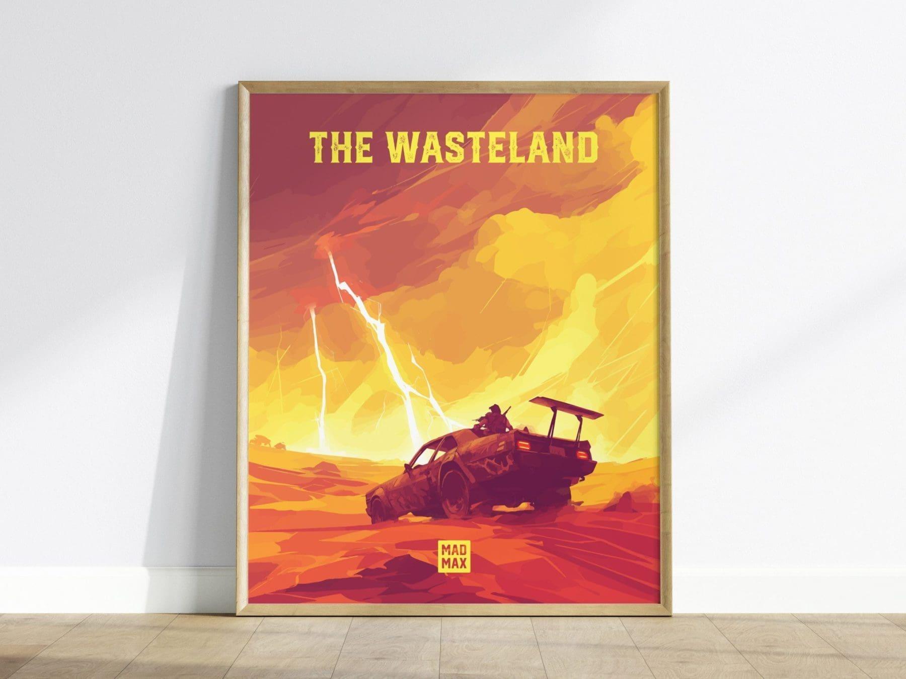 Framed poster of 'The Wasteland' with a desert scene and text on a white wall.