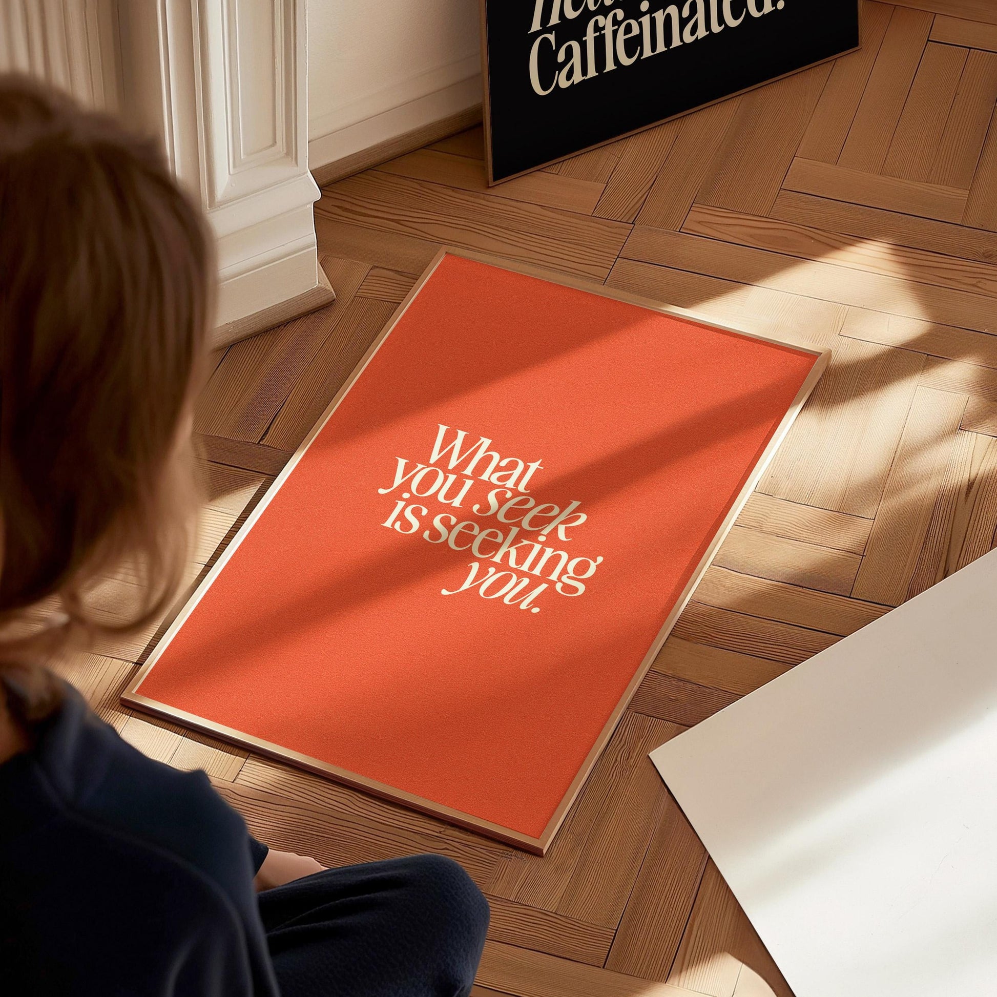 What You Seek motivational poster black frame close-up showing bold orange typography and inspirational message detail