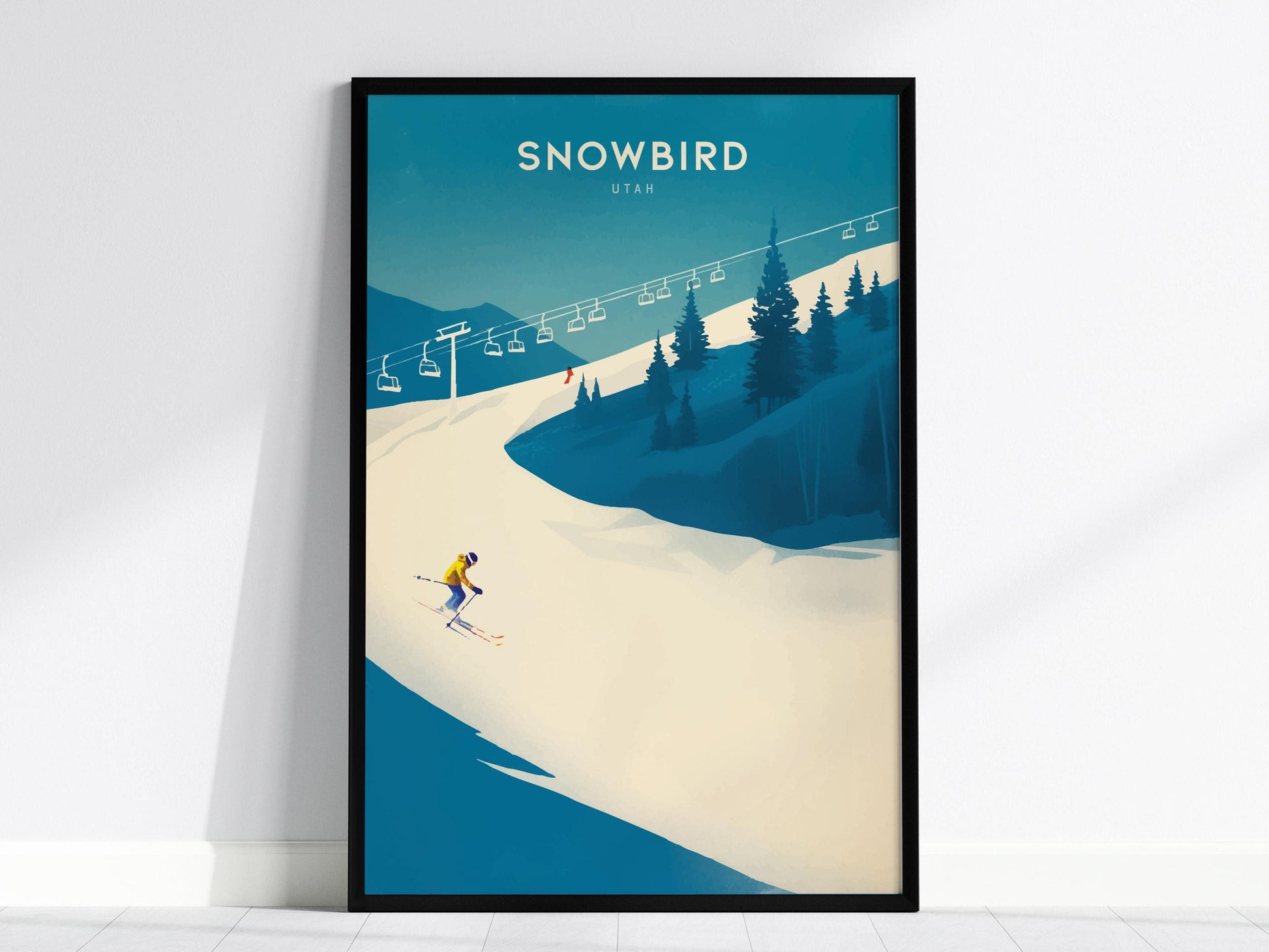 Framed poster of a skier on a snowy slope with 'Snowbird Utah' text.