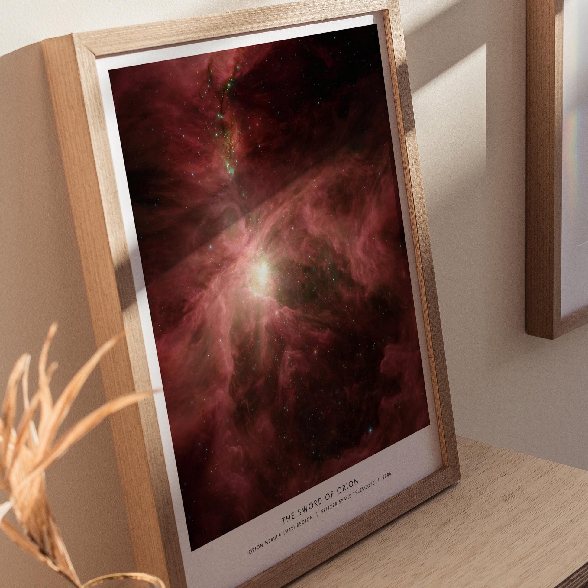 Natural wood framed Orion Nebula poster showing NASA Spitzer telescope M42 cosmic gas cloud artwork