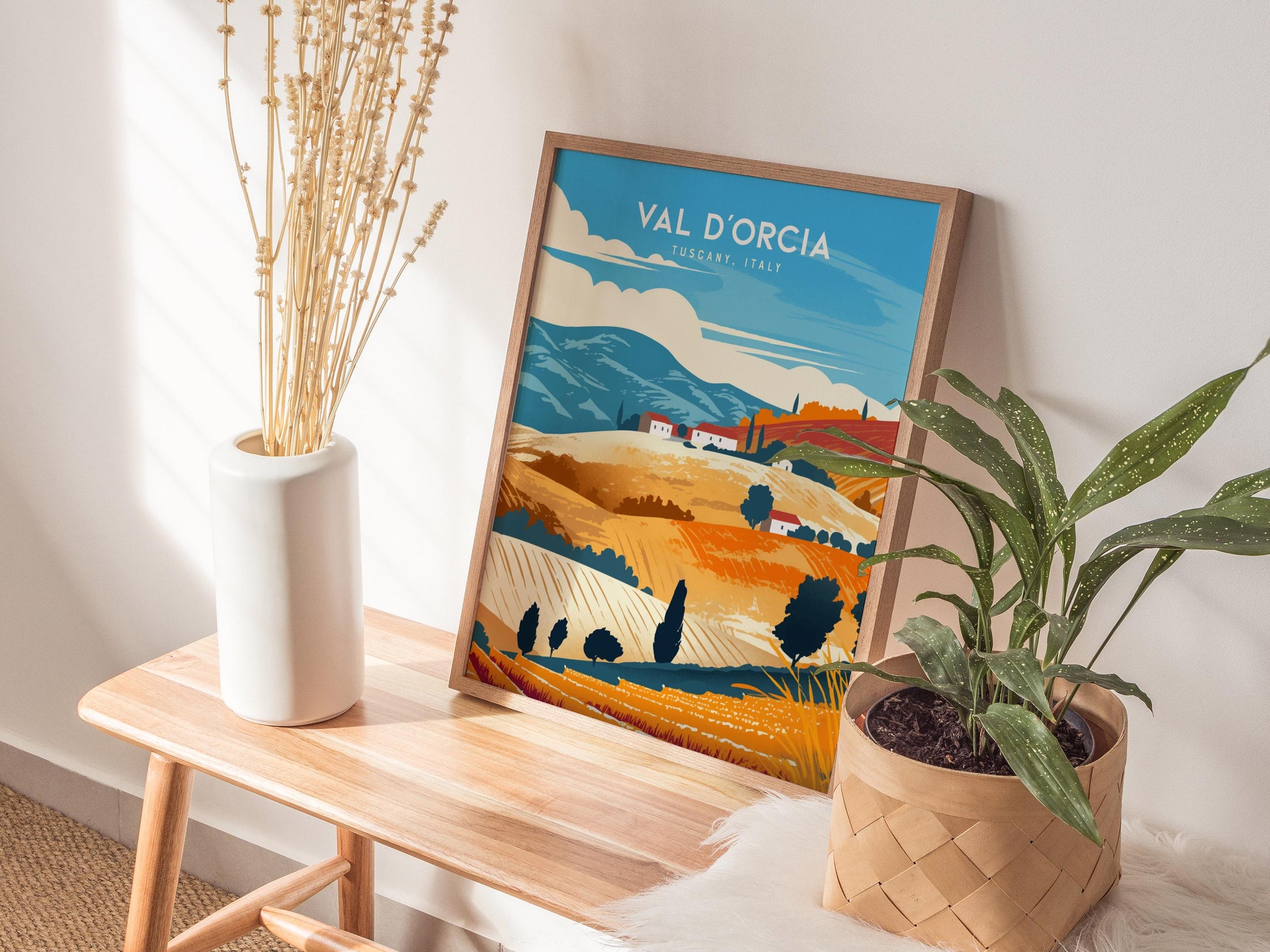 Natural wood framed Val d'Orcia poster showing Tuscany countryside with iconic cypress lined roads and rolling hills
