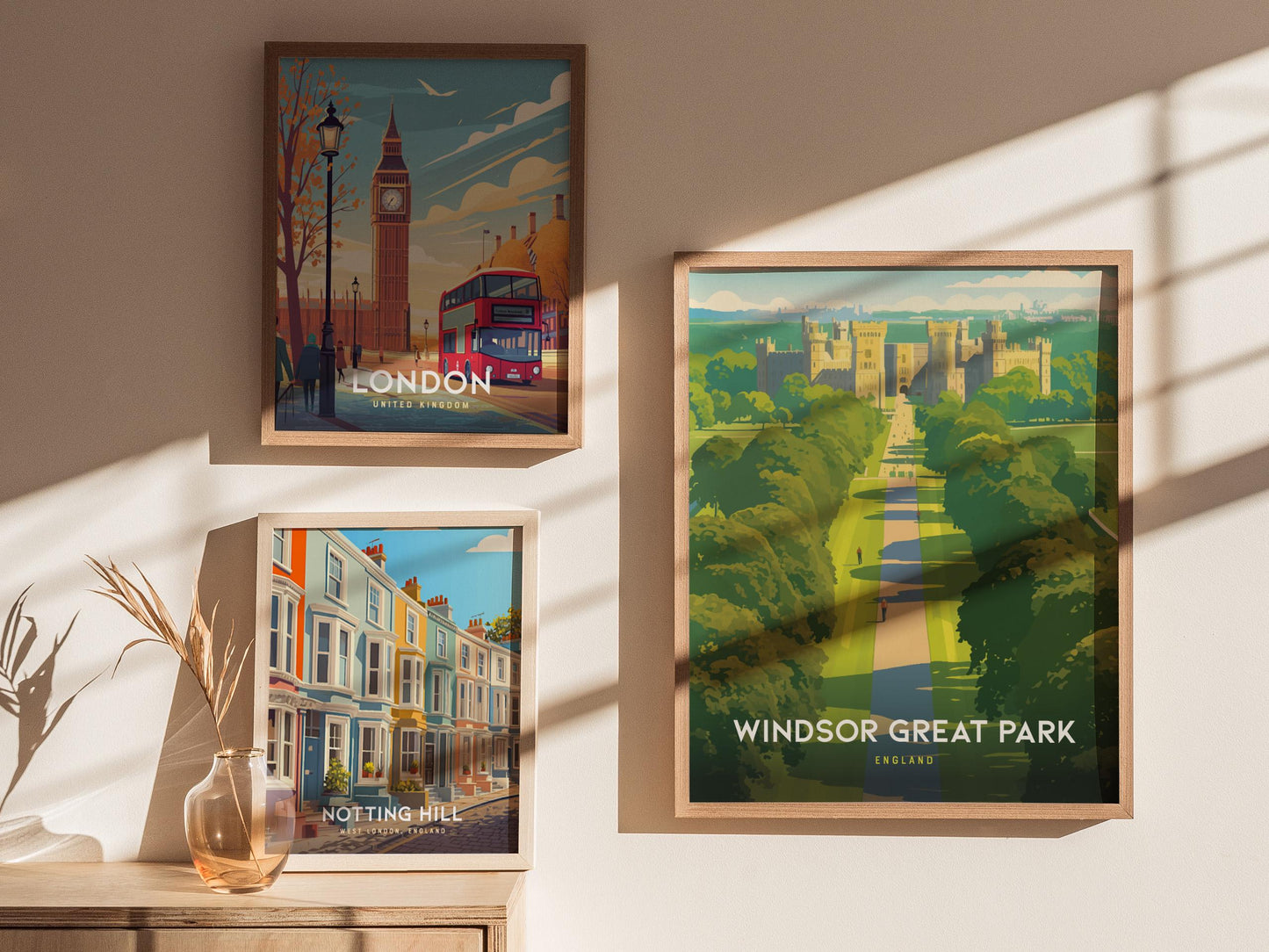 Three framed posters of London, Notting Hill, and Windsor Great Park on a wall.