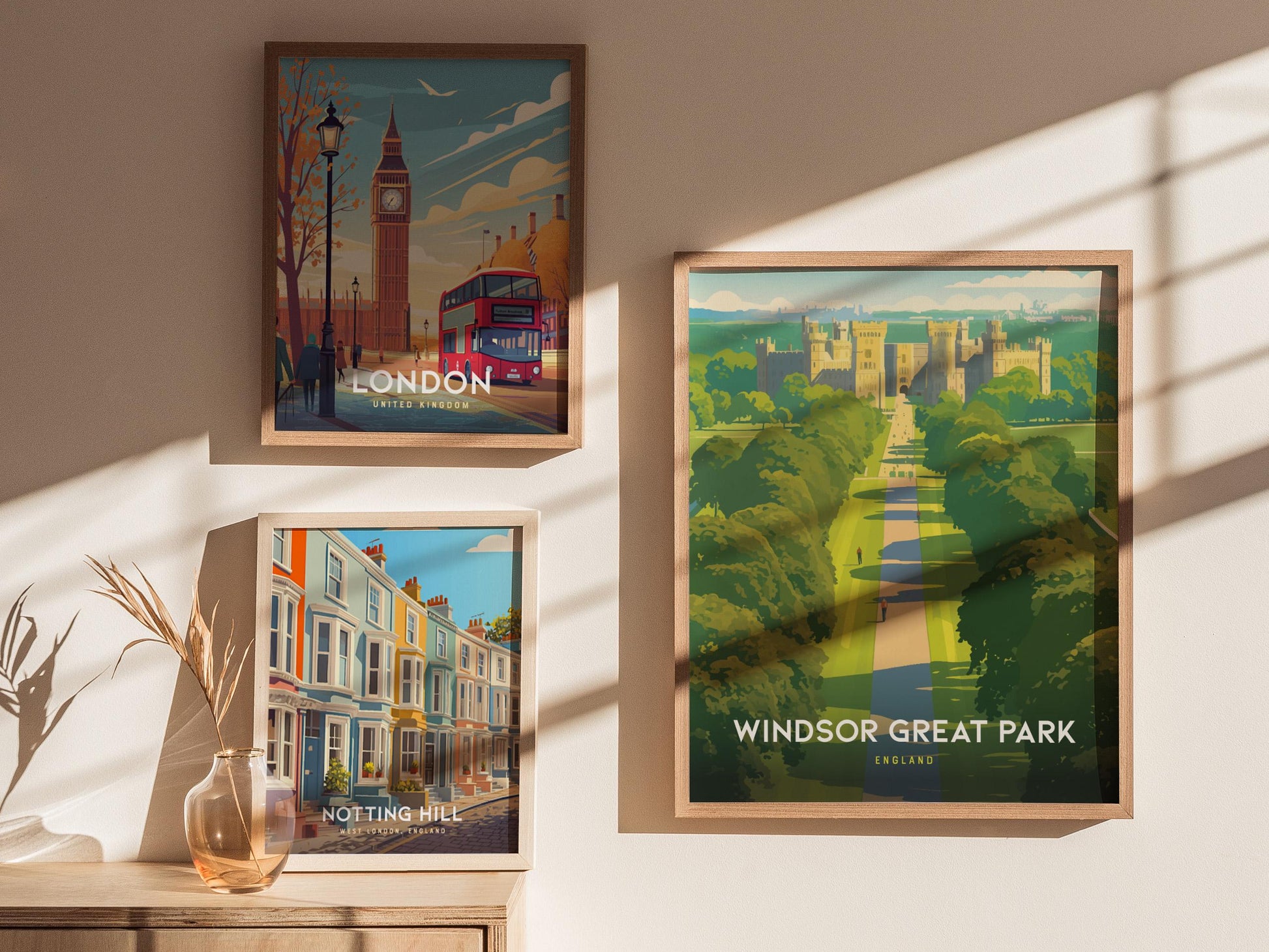 Three framed posters of London, Notting Hill, and Windsor Great Park on a wall.