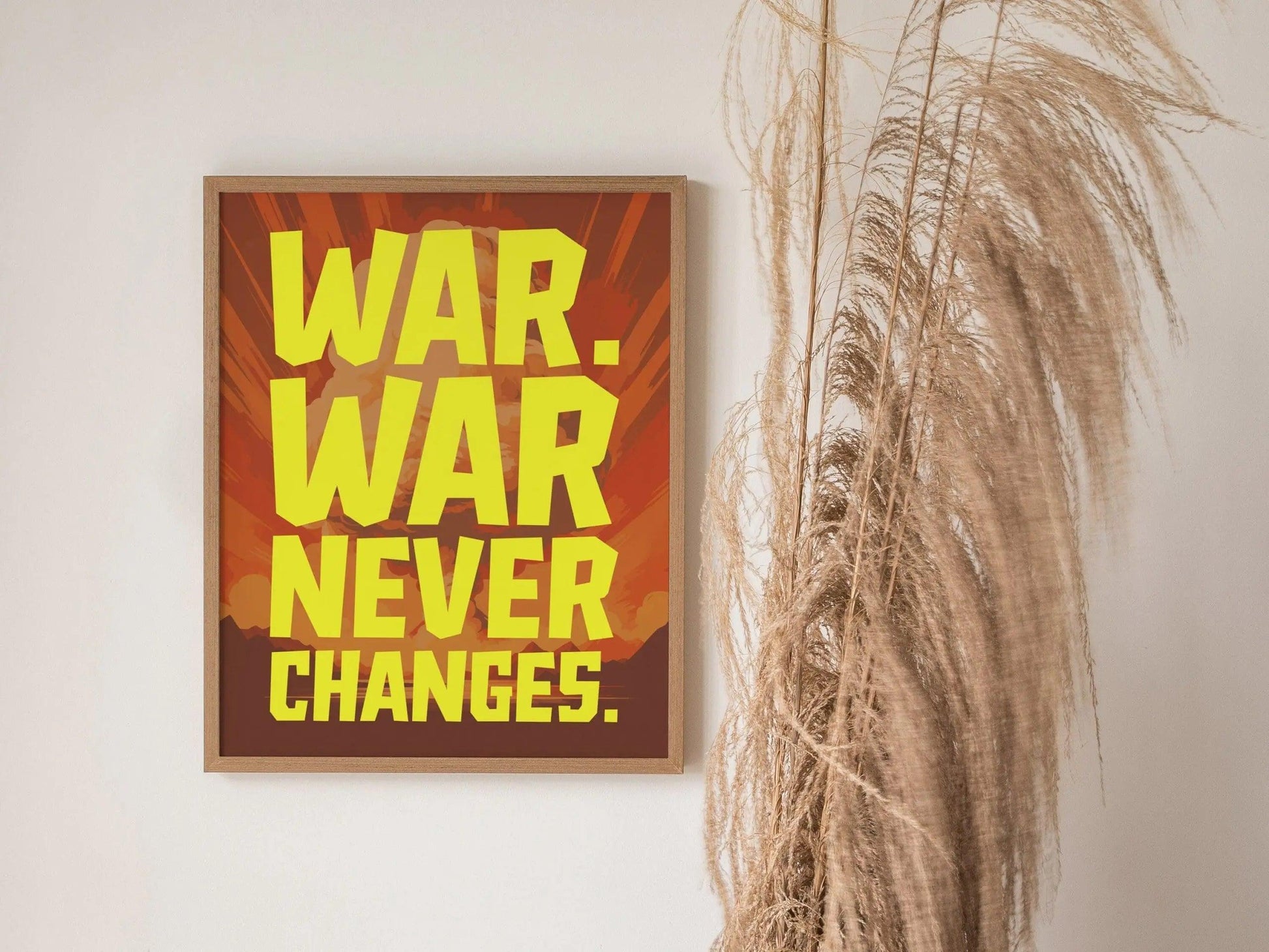 Fallout poster in white frame featuring War Never Changes iconic quote with retro-futuristic mushroom cloud design