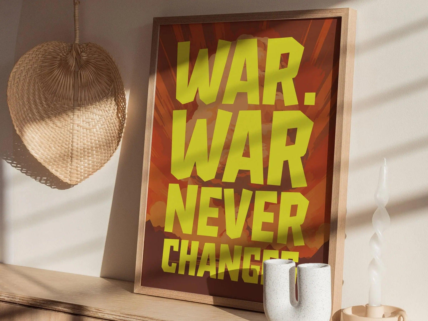 Framed poster with 'WAR. WAR NEVER CHANGES' text on a wall.