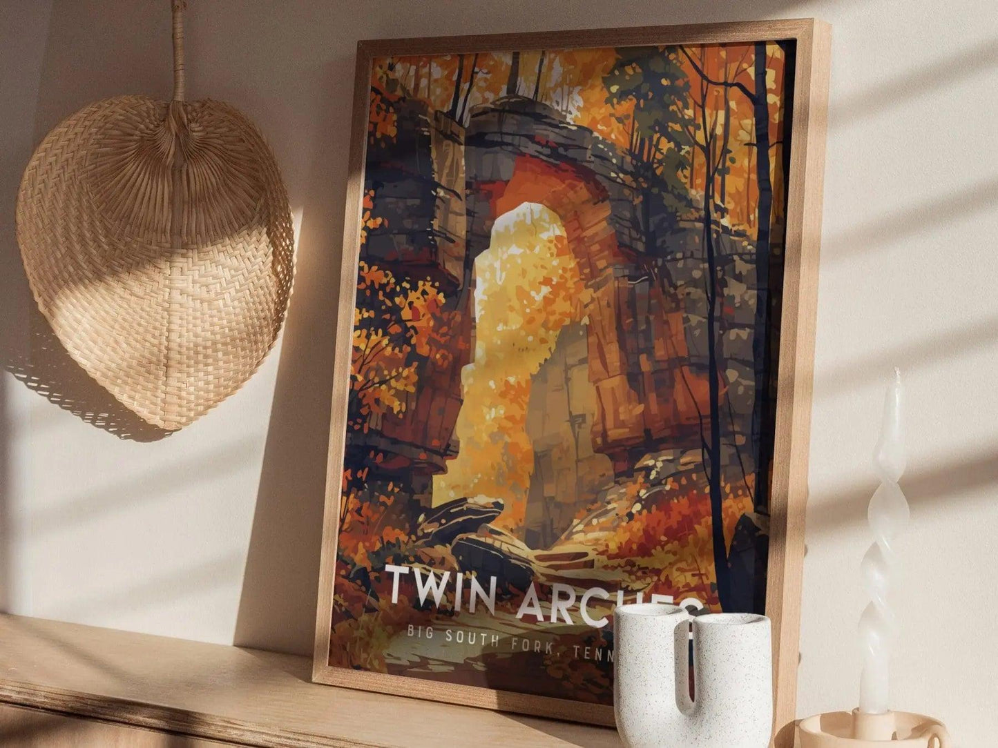 Framed poster of Twin Archers with a mug on a surface