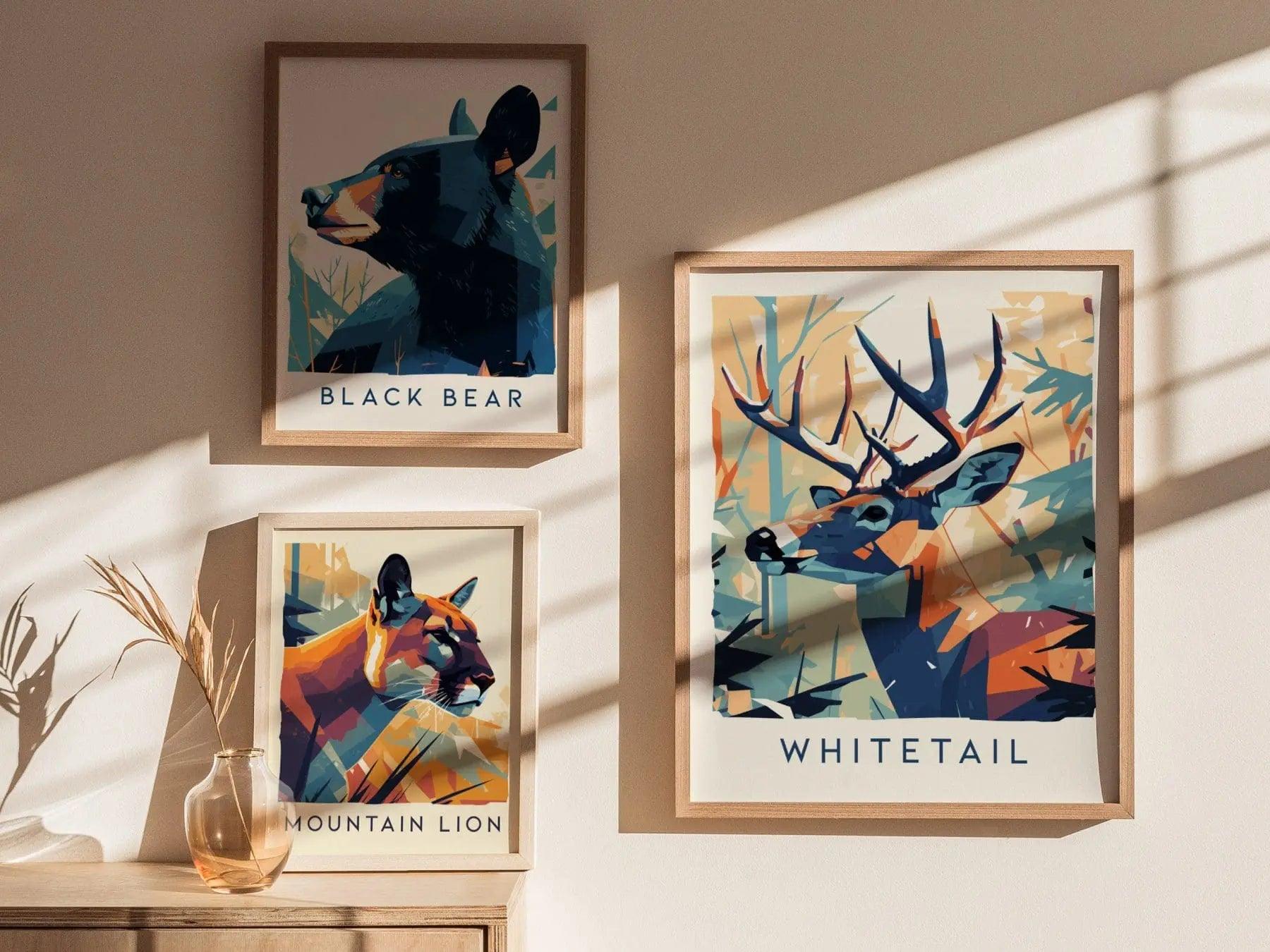 Framed animal art prints of a black bear, mountain lion, and whitetail deer on a wall.