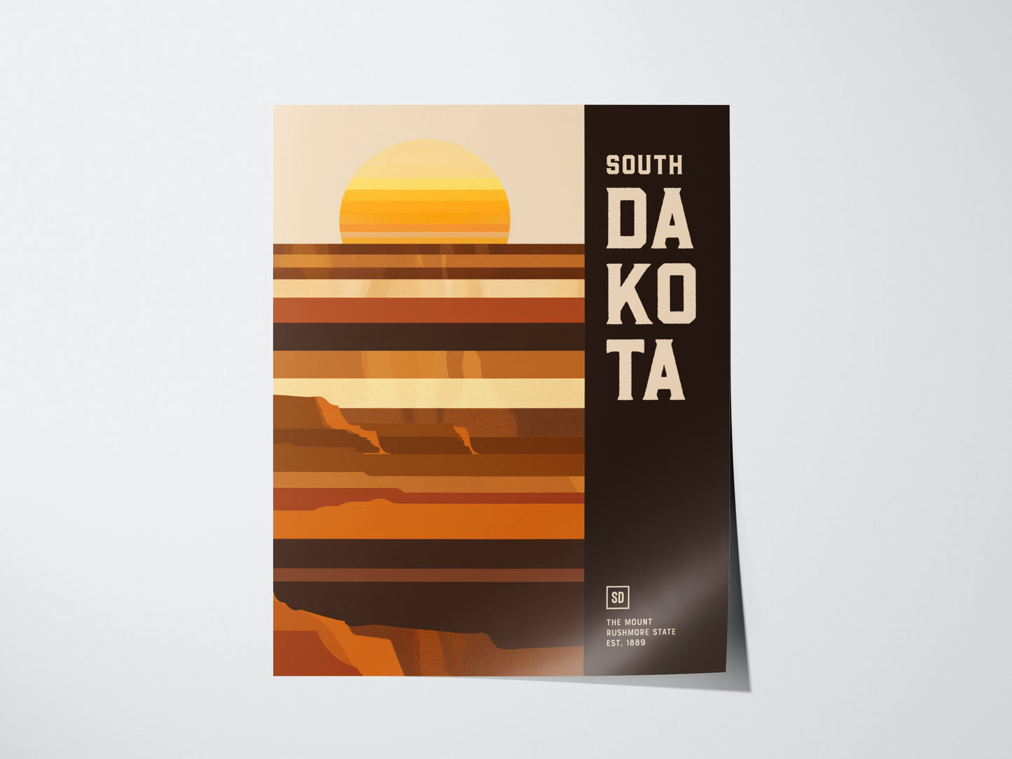 Minimalist South Dakota poster with bold geometric stripes in earthy tones, depicting a stylized sunset. The text South Dakota is prominently displayed on the right side.