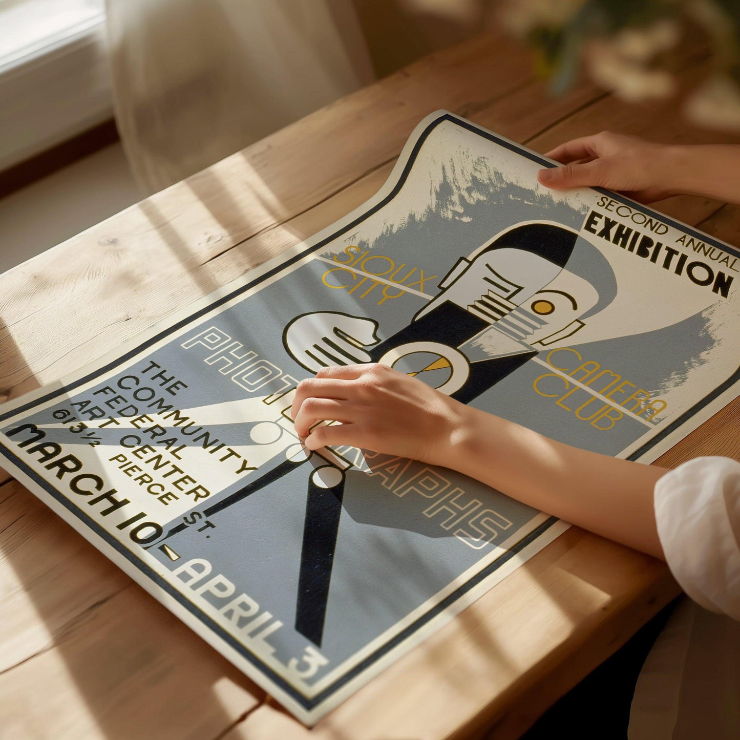 Art Deco photographer poster displayed in photography studio with vintage camera exhibition graphic design
