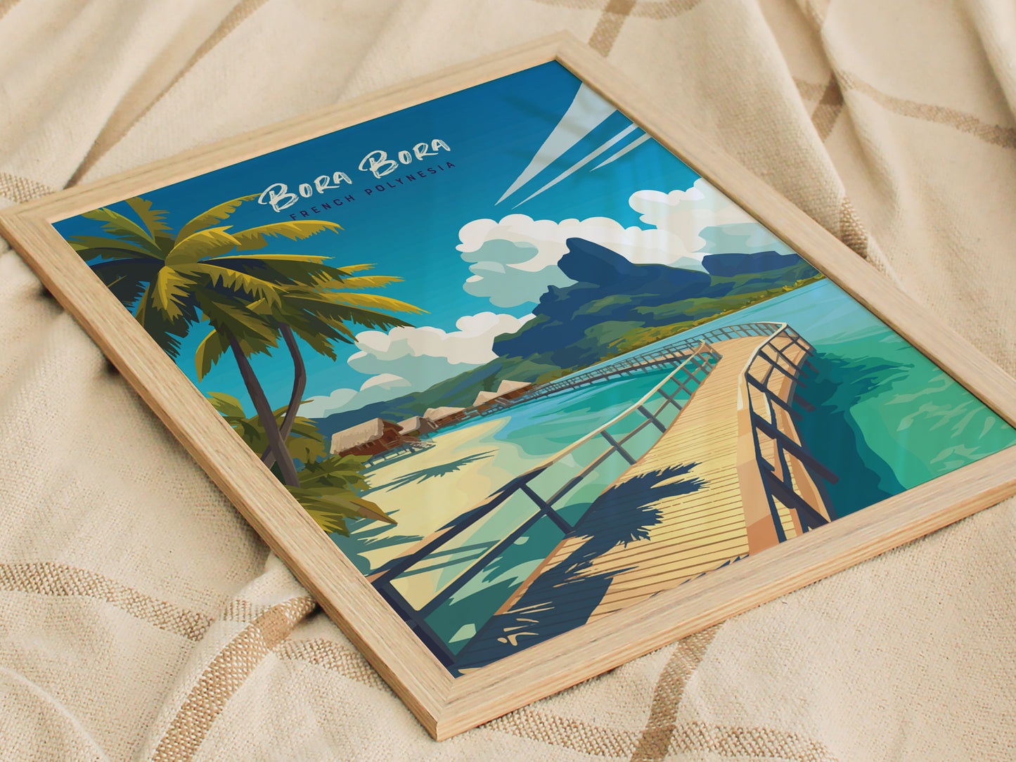 Framed artwork depicting Bora Bora, featuring a wooden walkway over turquoise waters, lush greenery, palm trees, and overwater bungalows against a vibrant blue sky.