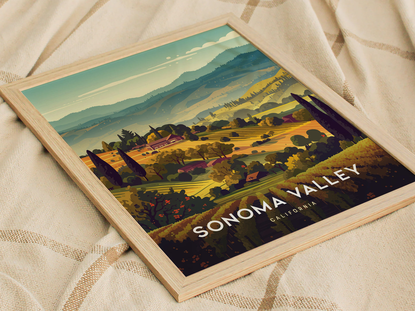 Framed poster depicting a vibrant Sonoma Valley landscape with rolling hills, vineyards, and trees under a clear sky. The text Sonoma Valley California is visible at the bottom.