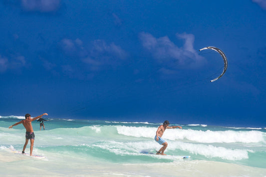 a man riding a surfboard on top of a wave