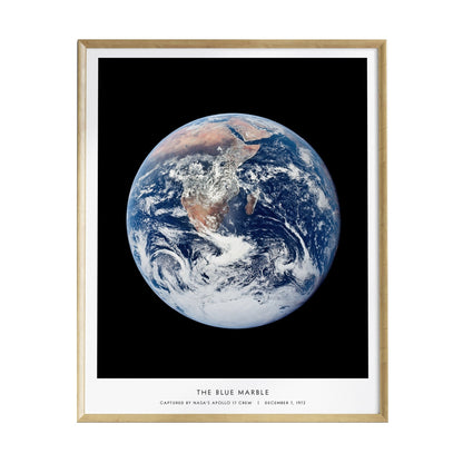 A framed poster features a stunning full-disk view of Earth, showcasing vibrant blues and greens alongside swirling white clouds.