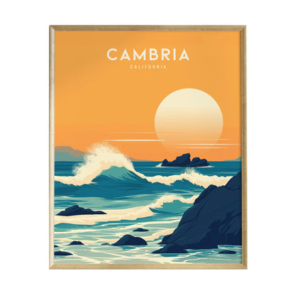 A vibrant poster depicting the coastal scenery of Cambria, California. The artwork features rolling blue waves crashing against rugged rocks under a warm orange sunset, with a large sun setting on the horizon, framed in a light wood border.