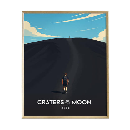 A vintage-modern art print titled Craters of the Moon depicts a lone hiker ascending a dark cinder cone under a bright blue sky with scattered clouds. The poster captures the rugged beauty of Idahos volcanic landscape, inviting adventure.