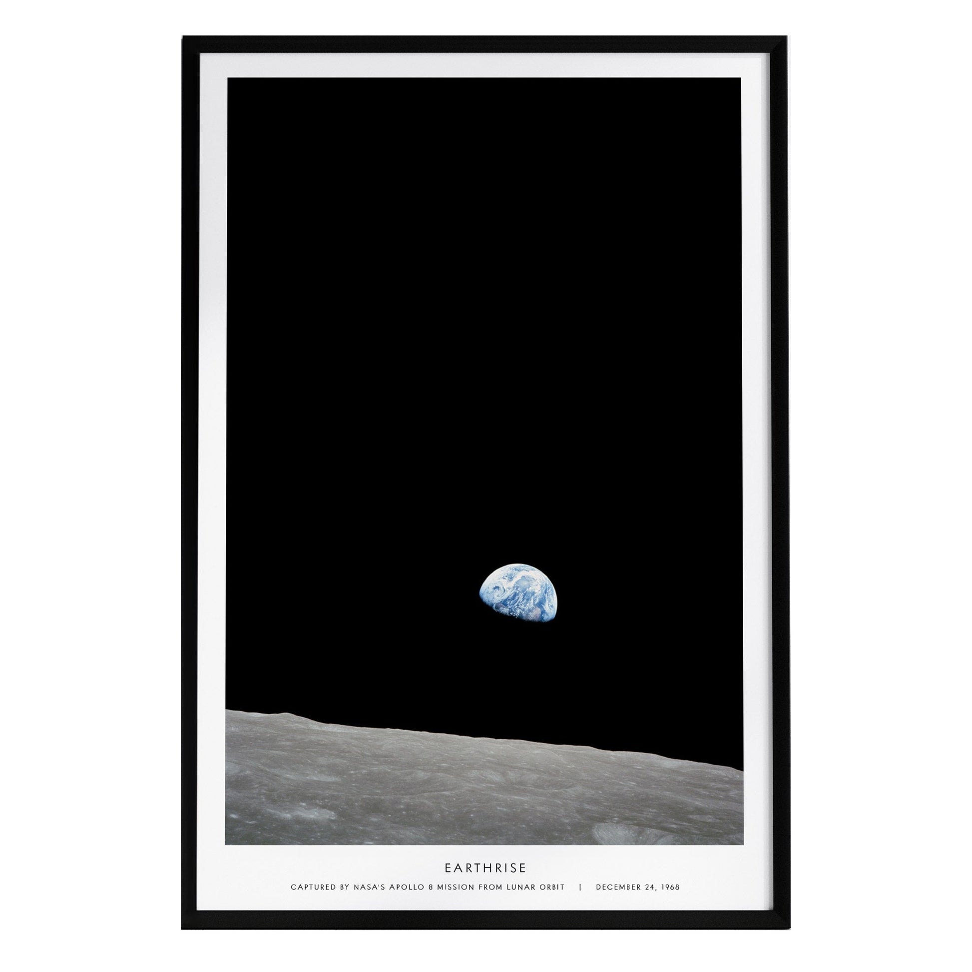A framed poster titled Earthrise displays the iconic view of Earth rising above the lunar horizon, captured during the Apollo 8 mission. The dark background highlights the fragile blue planet against the stark lunar surface.
