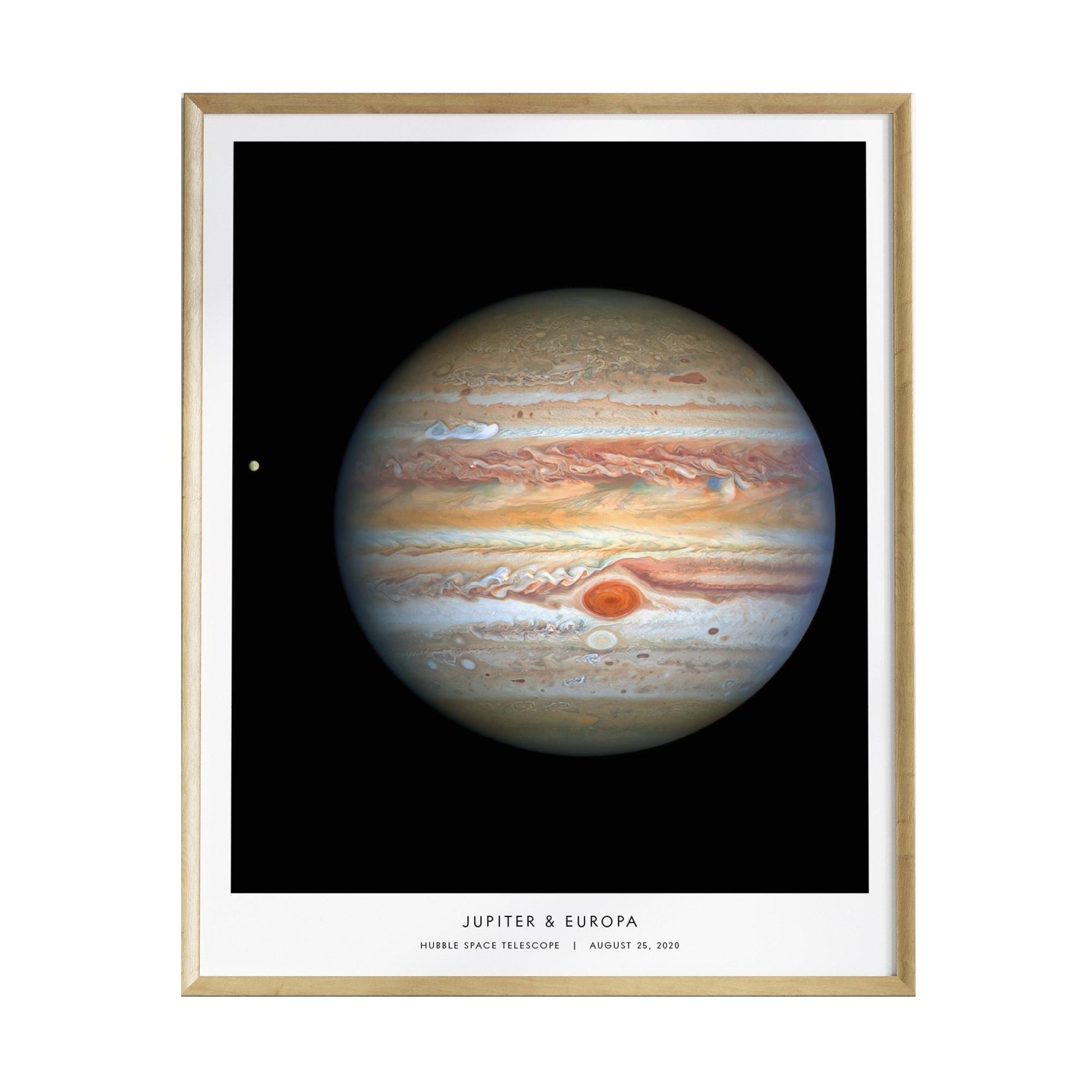 A beautifully framed poster features the planet Jupiter, showcasing its striking swirling cloud bands in shades of orange and brown, alongside a smaller celestial body, likely one of its moons.