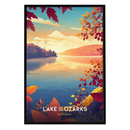 A vibrant framed travel print of Lake of the Ozarks showcases a serene autumn landscape, featuring colorful leaves in shades of orange, red, and yellow. The calm water reflects the warm hues of the sky, creating a tranquil atmosphere.