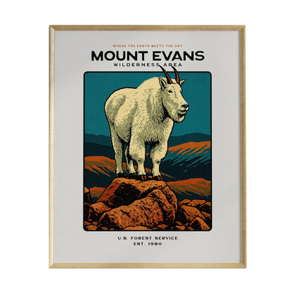 A framed poster featuring a stylized illustration of a mountain goat standing on a rocky outcrop, set against a backdrop of mountains and a colorful sky. The text reads Mount Evans Wilderness Area along with U.S. Forest Service and Est.