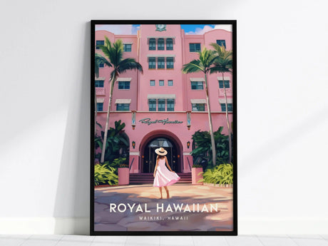 Framed poster of the Royal Hawaiian Hotel featuring pink Spanish-Moorish architecture, lush palm trees, and a woman in a white hat and dress walking towards the entrance.