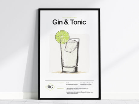 A framed poster displays a minimalist illustration of a gin and tonic cocktail with a lime slice garnish. The design includes the drinks recipe and elegant typography.