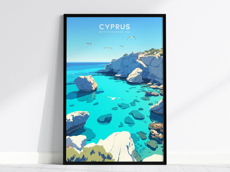 Framed poster of Cyprus featuring turquoise waters, rugged limestone cliffs, and soaring seabirds under a clear blue sky. Displayed against a white wall for a modern aesthetic.