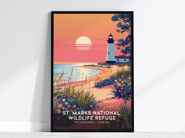 A framed poster depicts a sunset over a beach with a lighthouse, vibrant wildflowers, and coastal marshes, titled St. Marks National Wildlife Refuge, Tallahassee, Florida.