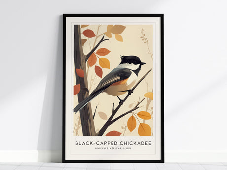 Framed art print of a Black-capped Chickadee perched on a branch with autumn leaves, set against a light beige background. The birds striking black cap and bib are prominently featured.