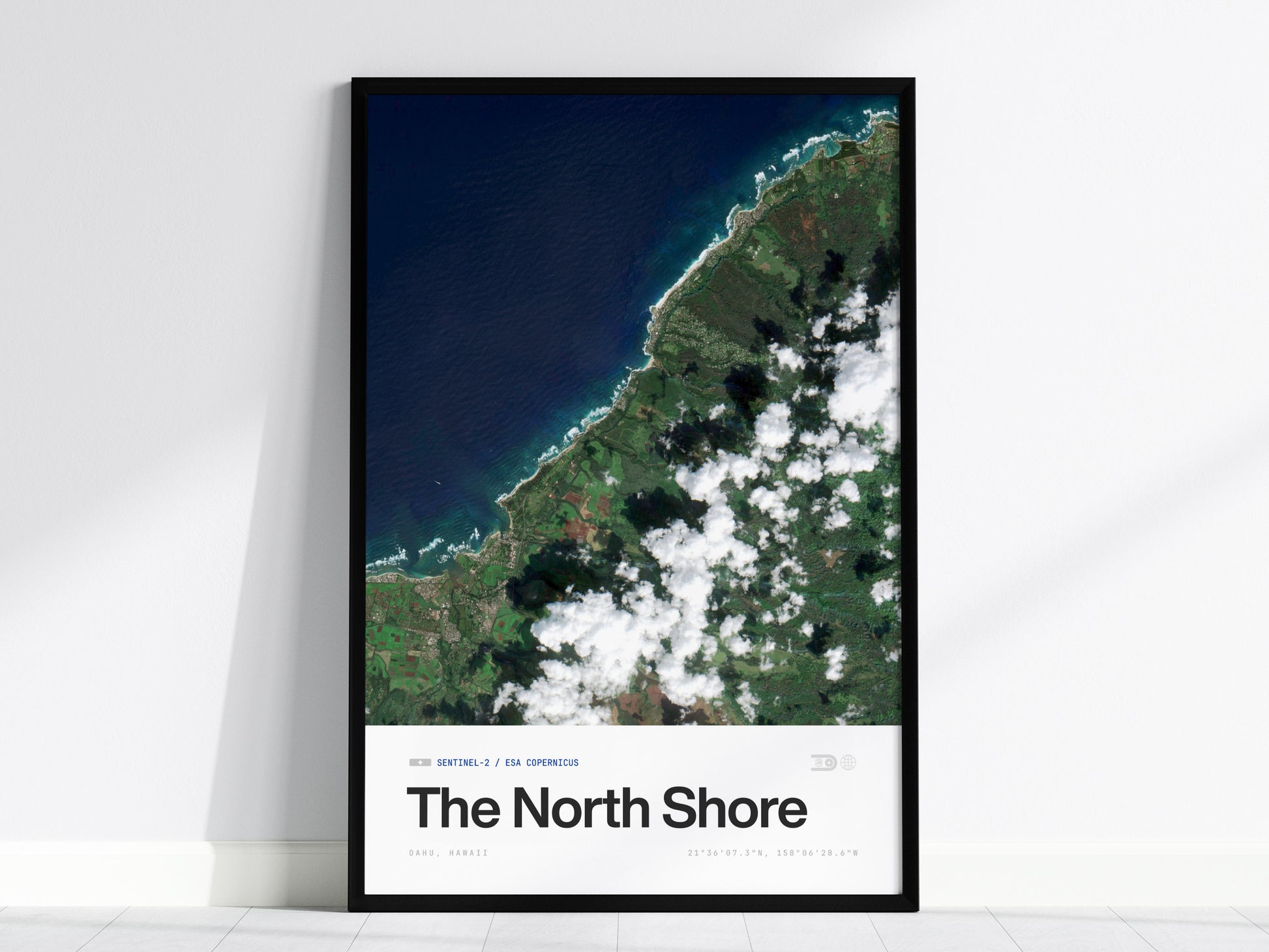 Framed satellite print of Oahu's North Shore, showcasing vibrant blues of the ocean and lush greens of the coastline, perfect travel art.