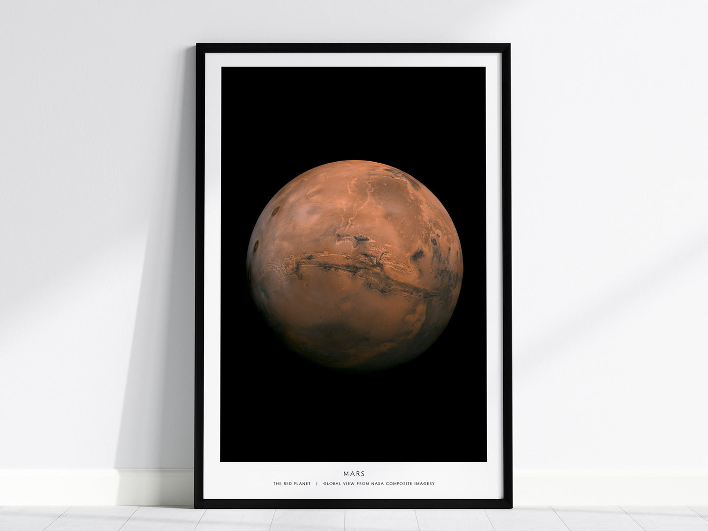 Framed print of Mars against a black frame on a white wall