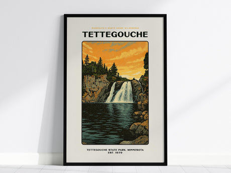 Framed poster of Tettegouche State Park featuring a stylized illustration of a waterfall cascading between cliffs with a sunset sky. The text reads Tettegouche State Park, Minnesota, Est. 1979.