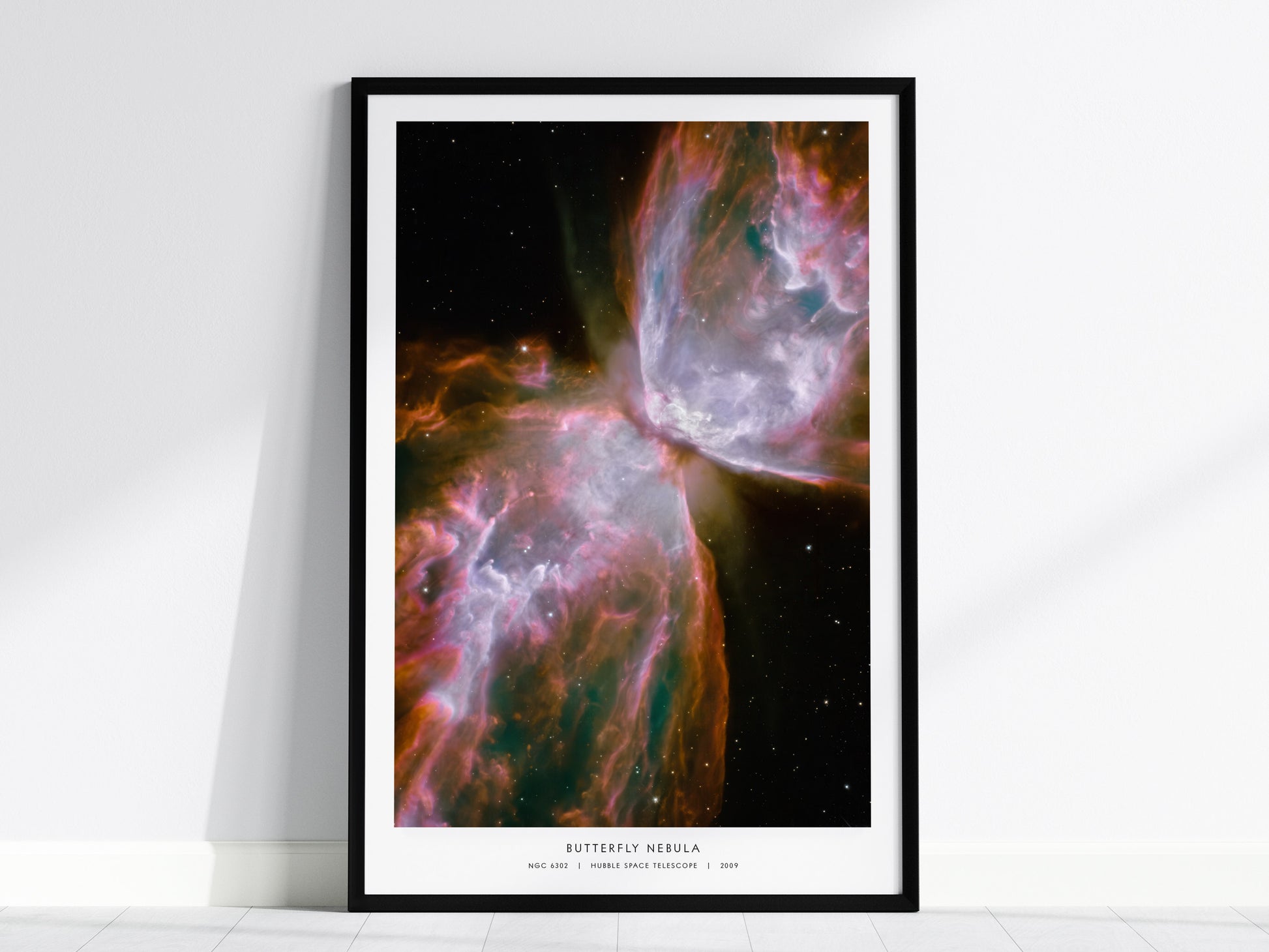 Vibrant Butterfly Nebula poster featuring symmetrical wings of gas and dust, framed art inspired by Hubble NASA photography.