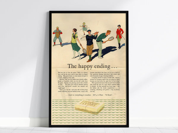 Framed vintage Ivory Soap advertisement featuring a 1920s illustration of people playing tennis, titled The Happy Ending, with a bar of Ivory soap depicted at the bottom.