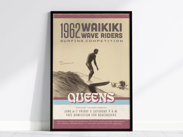 Framed vintage poster titled 1962 Waikiki Wave Riders Surfing Competition features a surfer riding a wave. Text includes event details and the word Queens in bold letters.