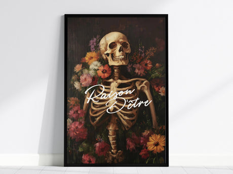 A framed poster features a skeleton surrounded by vibrant flowers with the French phrase Raison dÊtre in elegant script. The artwork blends gothic and botanical elements.
