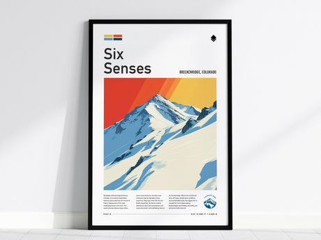 Framed poster featuring a stylized illustration of a snowy mountain peak with vibrant orange and yellow hues in the sky, titled Six Senses, depicting Breckenridge, Colorado.