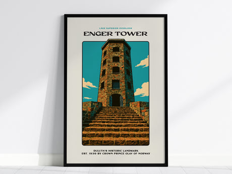 Framed poster featuring an illustration of Enger Tower against a blue sky with clouds. The stone tower stands atop a staircase, with text reading Lake Superior Overlook and additional details about the landmark.