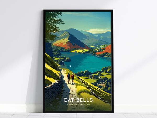 Framed poster of Cat Bells in Cumbria, England, showcasing a vibrant landscape with a path, two hikers, lush greenery, a stone wall, and a serene lake against distant mountains under a clear sky.