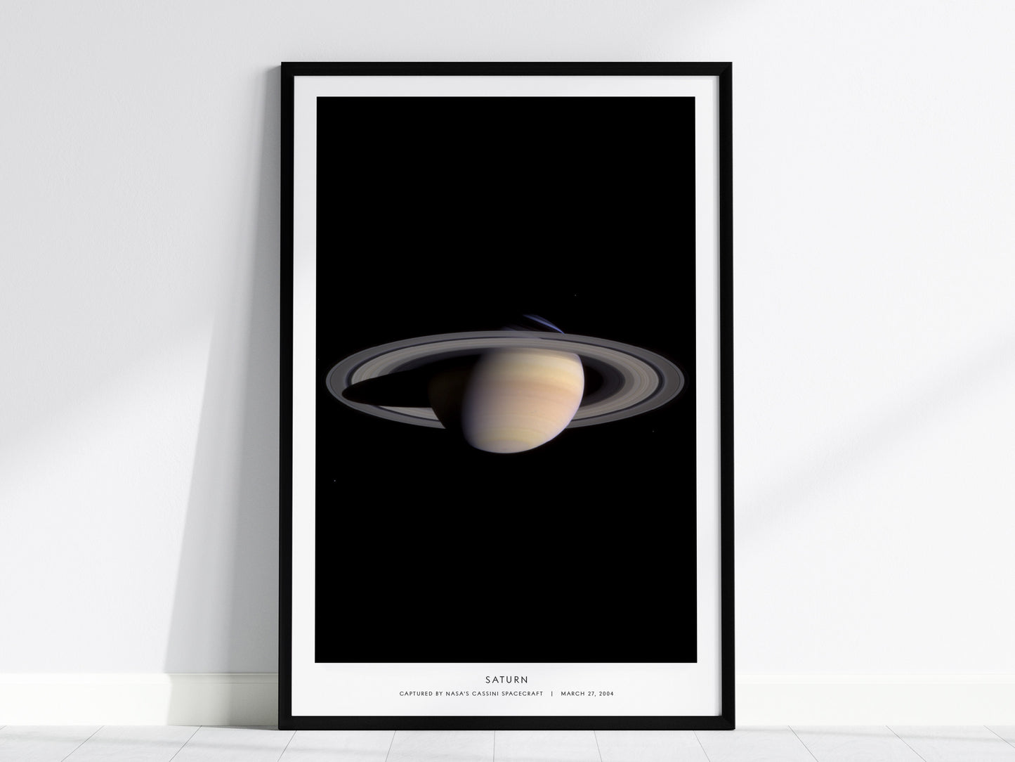 Saturn NASA poster featuring Cassini spacecraft image of planet and ring system against black space background