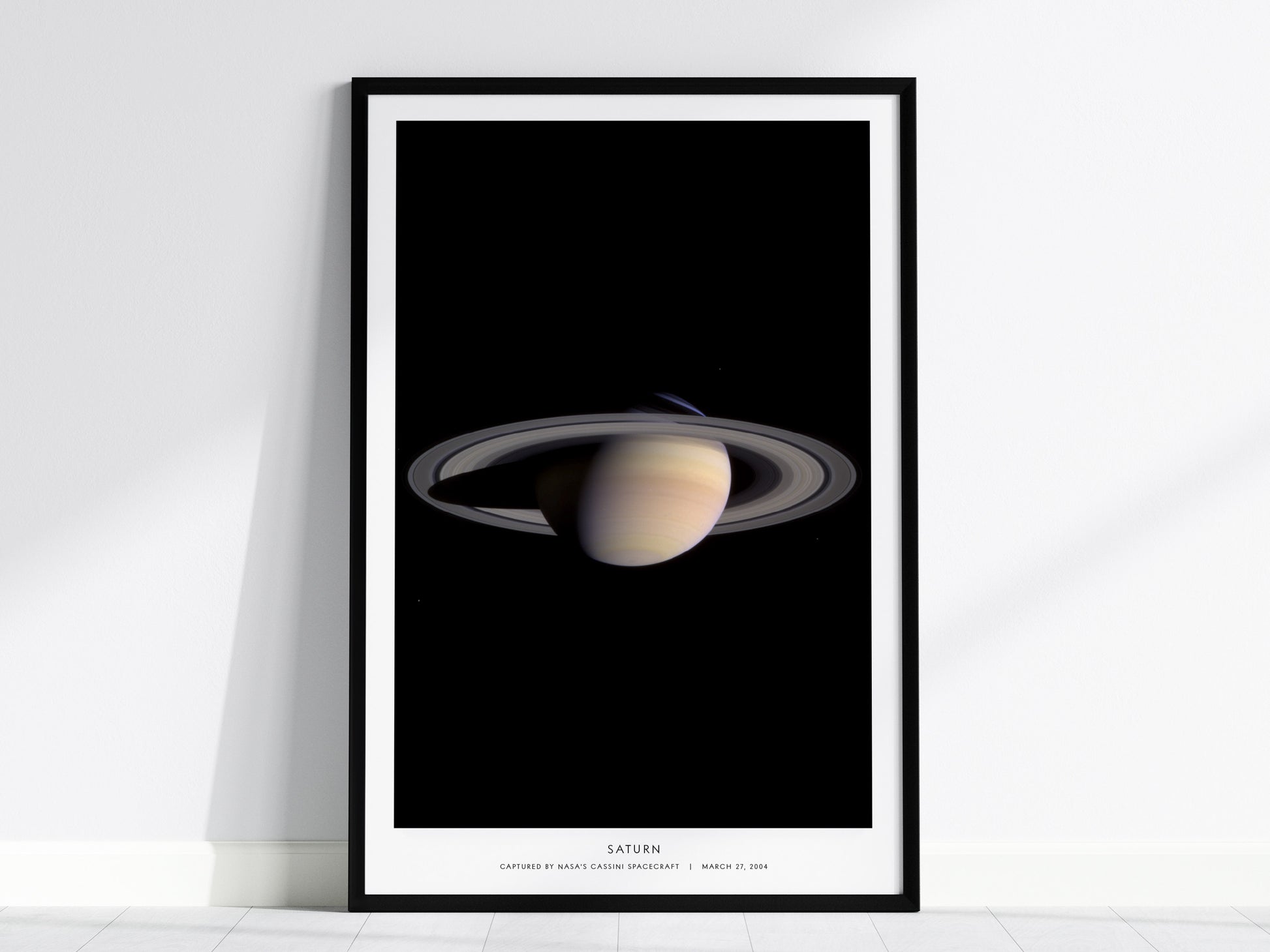 Saturn NASA poster featuring Cassini spacecraft image of planet and ring system against black space background