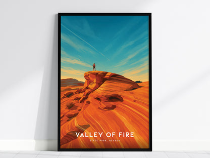 Framed vintage travel art poster of Valley of Fire, Nevada, showcasing vibrant red rock formations, a blue sky, and an adventurous figure.