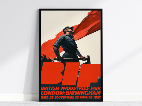 Framed vintage poster features a powerful industrial worker against a bold red backdrop, with large BIF text and details of the British Industries Fair in 1932.