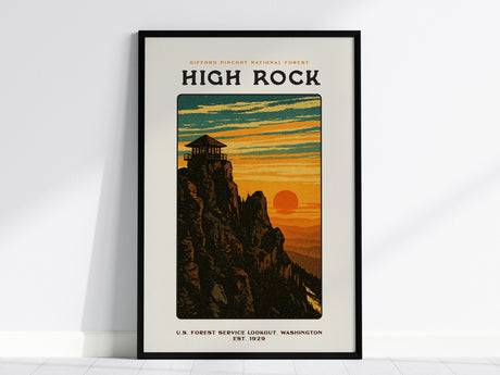 Framed vintage-style poster of High Rock in Gifford Pinchot National Forest, featuring a fire lookout on a rugged cliff. The sunset casts an orange glow over the Cascades, with the text High Rock prominently displayed.