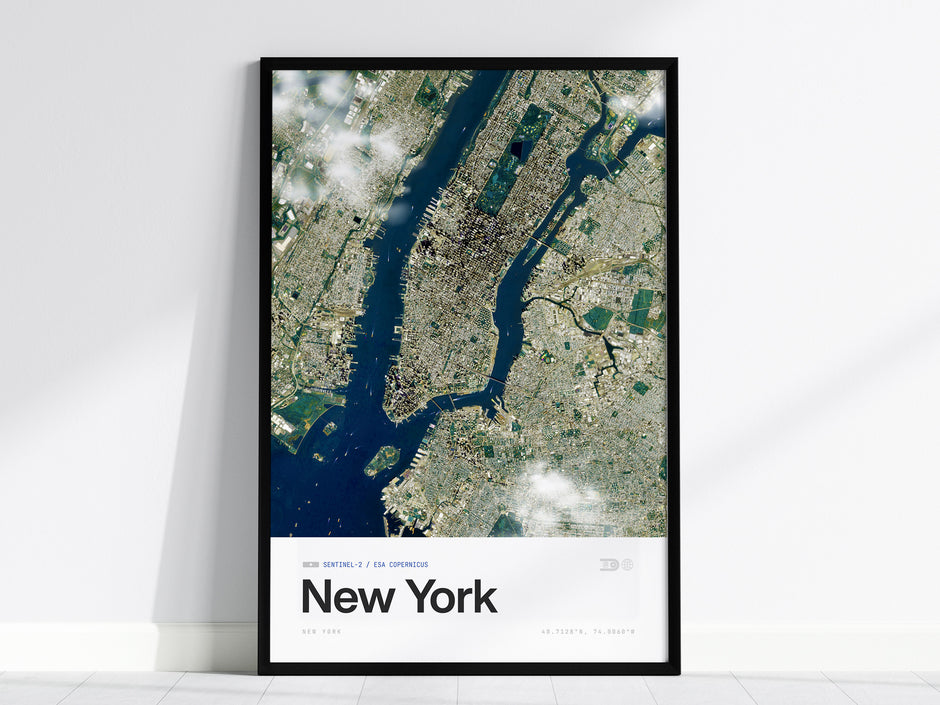 Framed aerial poster of New York City showcasing satellite view with Central Park, vibrant waterways, and urban neighborhoods.