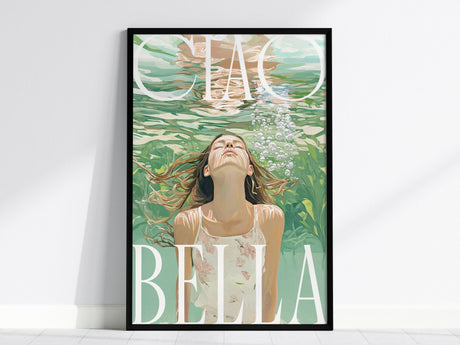 A framed art print shows a woman underwater, looking up with bubbles rising. The background features lush green hues and large Ciao Bella typography.