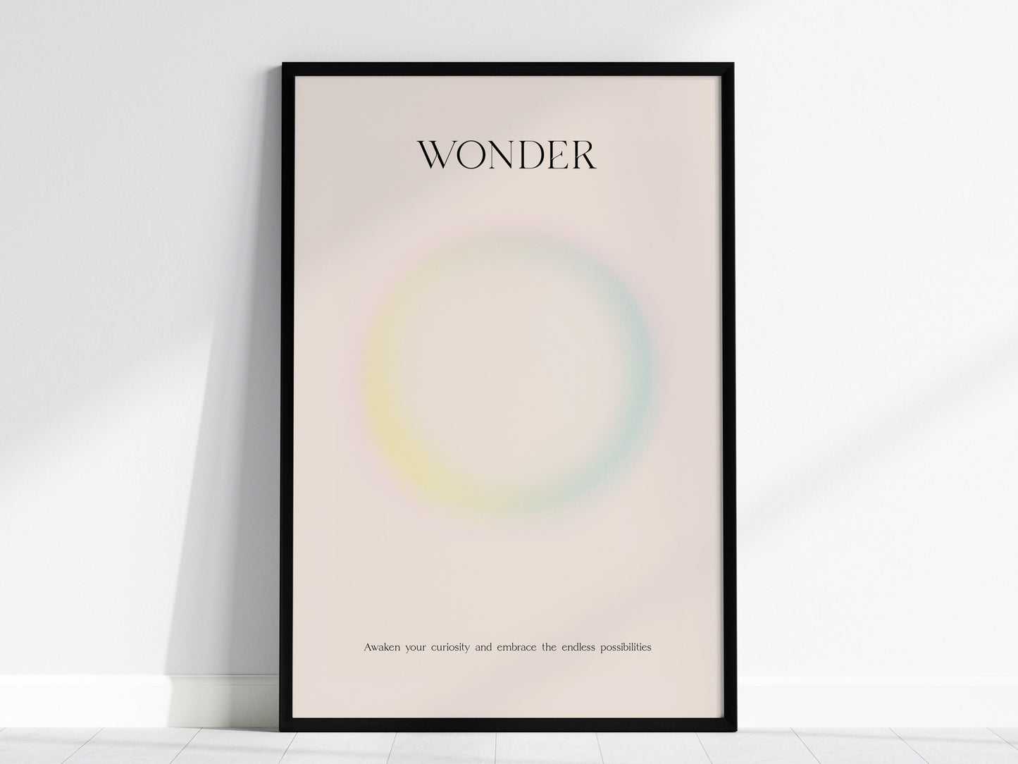 Framed WONDER wall art print featuring a pastel gradient design with soft pink, yellow, and blue hues, perfect for travel art décor.