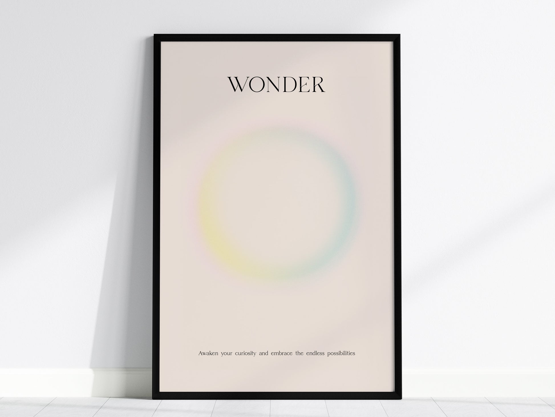 Framed WONDER wall art print featuring a pastel gradient design with soft pink, yellow, and blue hues, perfect for travel art décor.