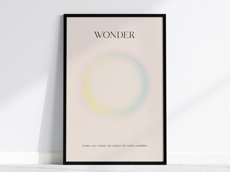 Framed WONDER wall art print featuring a pastel gradient design with soft pink, yellow, and blue hues, perfect for travel art décor.