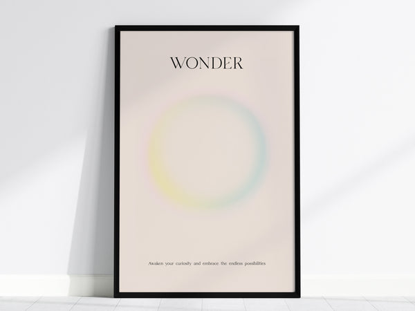 Framed WONDER wall art print featuring a pastel gradient design with soft pink, yellow, and blue hues, perfect for travel art décor.
