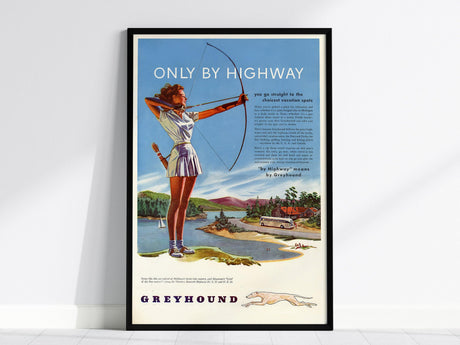 A vintage Greyhound poster features a woman with a bow against a scenic backdrop, a classic bus, and bold Only By Highway text. The artwork is framed in black.